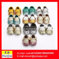 Top selling products in alibaba wholesale OEM shiny sequin baby shoes genuine leather tassel soft sole baby prewalker